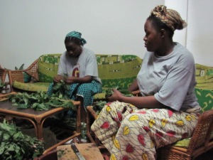 Sisters Micheline & Pascaline preparing one of the leafy vegetables